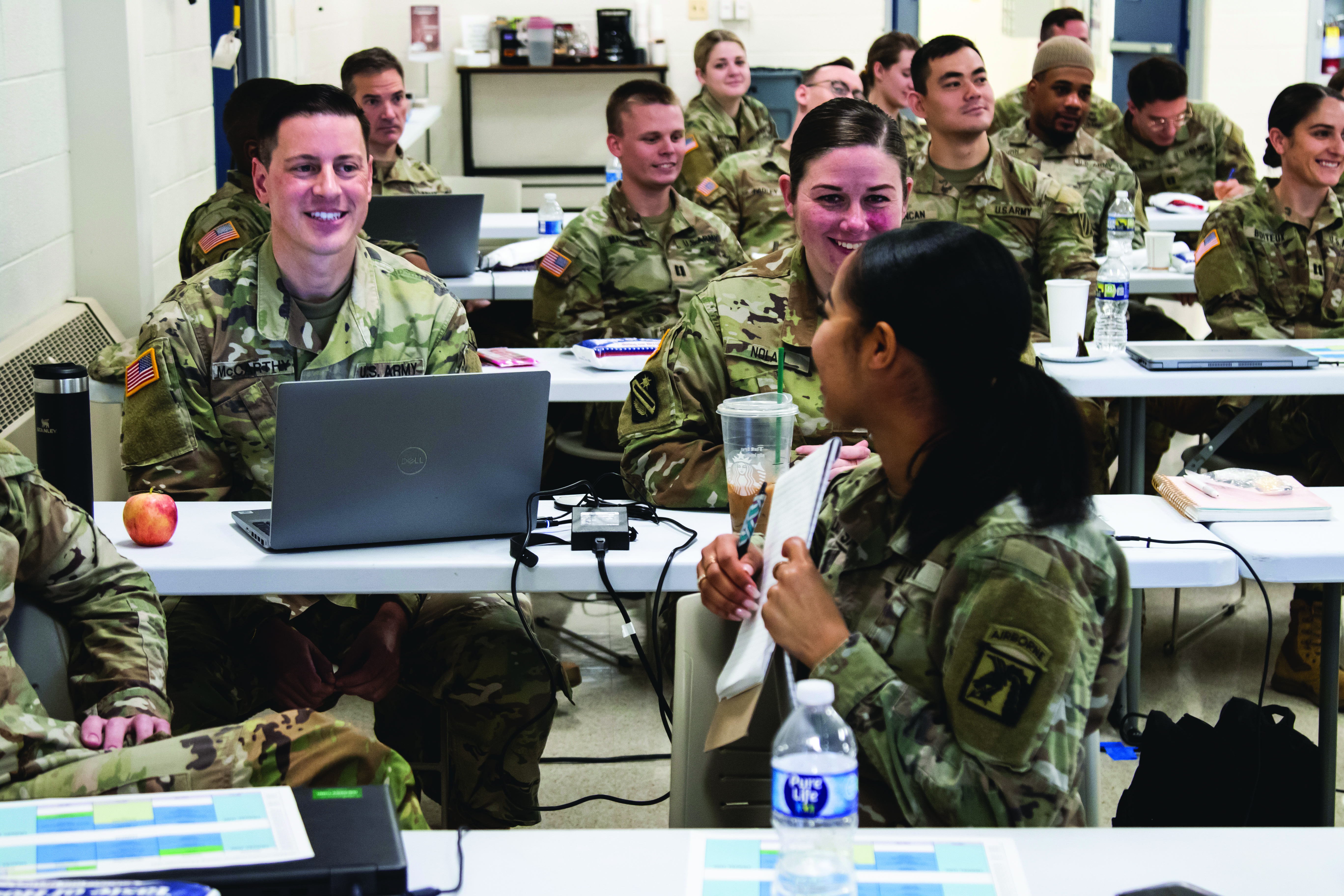 Active and Reserve component attendees discuss their unique experiences during the integrated SVC Regional Training held 5-7 December 2023 at the USARLC in Gaithersburg, MD. In this photograph, CPT Aldavina DosSantos, Army SVC (XVIII Airborne Corps, Fort Liberty) (front-right) exchanges ideas with MAJ Keith A. McCarthy, USAR SVC Northeast regional manager (139th Legal Operations Detachment (LOD)) (left) and SFC Jessica F. Nolan, USAR SVC paralegal (139th LOD) (right). (Credit: 1LT Amber Lamb, USARLC)